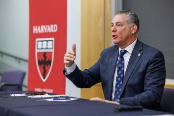 Sheriff Koutoujian speaking from a seated position.